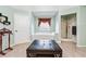 Relaxing bathroom showcasing a bathtub, walk-in shower, and stylish ottoman with contemporary decor at 1119 Simonton Glen Way, Lawrenceville, GA 30045