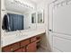 Clean bathroom with white countertops, wooden cabinets, and a large mirror with optimal functionality at 1119 Simonton Glen Way, Lawrenceville, GA 30045
