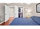 Cozy bedroom with hardwood floors, a walk-in closet, and a large window offering bright and airy feel at 1119 Simonton Glen Way, Lawrenceville, GA 30045