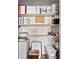 Organized closet with multiple shelves and storage containers for maximum storage at 1119 Simonton Glen Way, Lawrenceville, GA 30045