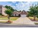 Charming home with well-manicured lawn, mature trees, and a two-car garage at 1119 Simonton Glen Way, Lawrenceville, GA 30045