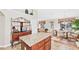 Open concept kitchen with island, stainless appliances, and access to breakfast area at 1119 Simonton Glen Way, Lawrenceville, GA 30045