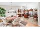 Eat-in kitchen featuring stainless steel appliances, an island, and a dining area for casual meals at 1119 Simonton Glen Way, Lawrenceville, GA 30045