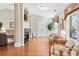 Inviting living room with hardwood floors, a fireplace, and access to a sunroom or patio at 1119 Simonton Glen Way, Lawrenceville, GA 30045