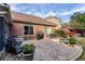 Brick patio with outdoor seating and manicured landscaping at 1119 Simonton Glen Way, Lawrenceville, GA 30045
