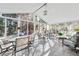 Bright and airy sunroom with multiple seating areas and panoramic views at 1119 Simonton Glen Way, Lawrenceville, GA 30045