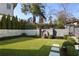 Well-manicured backyard with stone wall, fountain, and lush landscaping at 18 Polo Ne Dr, Atlanta, GA 30309