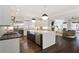 Open concept kitchen featuring quartz countertops, a farmhouse sink, and stainless steel appliances at 18 Polo Ne Dr, Atlanta, GA 30309