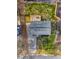 An aerial view of a well-maintained property, highlighting a spacious backyard, driveway, and the home's roof at 2831 Spruce Point Rd, South Fulton, GA 30349