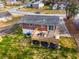 Aerial view of a cozy backyard deck with a seating area, perfect for outdoor relaxation and entertaining guests at 2831 Spruce Point Rd, South Fulton, GA 30349