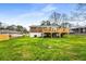 Back exterior of the home features a deck, lawn, and brick siding at 2831 Spruce Point Rd, South Fulton, GA 30349