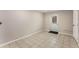 Bright basement area with tiled flooring and white door to exterior at 2831 Spruce Point Rd, South Fulton, GA 30349