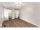 Spacious bedroom features wood-look flooring, ceiling fan, and ensuite bathroom with sliding barn door at 2831 Spruce Point Rd, South Fulton, GA 30349