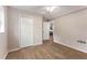 Cozy bedroom featuring wood-look flooring, open doorway and closet at 2831 Spruce Point Rd, South Fulton, GA 30349