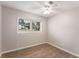 Bright bedroom features updated ceiling fan and window with blinds providing plenty of natural light at 2831 Spruce Point Rd, South Fulton, GA 30349