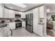 Modern kitchen with white cabinets, subway tile backsplash, and stainless steel appliances at 2831 Spruce Point Rd, South Fulton, GA 30349