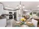 Bright eat-in kitchen with stainless steel appliances and sleek white cabinetry at 2831 Spruce Point Rd, South Fulton, GA 30349