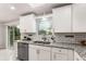 Well-lit kitchen with stainless steel appliances, granite countertops, and white subway tile backsplash at 2831 Spruce Point Rd, South Fulton, GA 30349