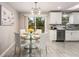 Eat-in kitchen featuring modern finishes and a view of the backyard deck at 2831 Spruce Point Rd, South Fulton, GA 30349