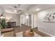 Cozy living room with wood-look flooring, modern ceiling fan and accent rug at 2831 Spruce Point Rd, South Fulton, GA 30349
