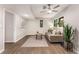 Cozy living room features wood-look flooring, a modern ceiling fan, and a comfortable couch at 2831 Spruce Point Rd, South Fulton, GA 30349