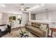 Inviting living room with stylish furniture and seamless access to the modern kitchen at 2831 Spruce Point Rd, South Fulton, GA 30349