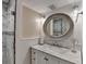 Bathroom with vanity and large mirror, shower with white and gray tile at 1037 Martin Rd, Stone Mountain, GA 30088