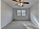 Bedroom featuring natural light from the window and neutral colored walls at 1037 Martin Rd, Stone Mountain, GA 30088