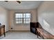 Bedroom featuring natural light from the window and vintage furnishings on neutral colored walls at 1037 Martin Rd, Stone Mountain, GA 30088