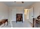 Bedroom featuring vintage furnishings, two doorways, and neutral colored walls at 1037 Martin Rd, Stone Mountain, GA 30088