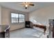 Bedroom featuring natural light from the window and vintage furnishings on neutral colored walls at 1037 Martin Rd, Stone Mountain, GA 30088