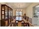 Formal dining room with a large table, china cabinet, and chandelier, perfect for hosting gatherings at 1037 Martin Rd, Stone Mountain, GA 30088