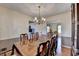 Spacious dining room with an elegant table and seating, complemented by a classic china cabinet at 1037 Martin Rd, Stone Mountain, GA 30088