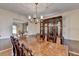 Formal dining room with expansive table, ideal for entertaining guests, and a traditional china cabinet at 1037 Martin Rd, Stone Mountain, GA 30088