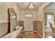 Elegant foyer with hardwood floors, a decorative mirror, and a stylish chandelier at 1037 Martin Rd, Stone Mountain, GA 30088