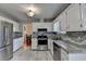 Bright kitchen with stainless steel appliances, including a refrigerator and oven, for a modern culinary experience at 1037 Martin Rd, Stone Mountain, GA 30088