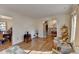 Living room with hardwood floors, white walls, and ornate decor creates an inviting, classic ambiance at 1037 Martin Rd, Stone Mountain, GA 30088