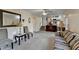 Bright living room with chairs, mirror, decor, and stairs to kitchen area at 1037 Martin Rd, Stone Mountain, GA 30088