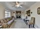 Living room featuring a stone fireplace, neutral carpet, and window providing natural light at 1037 Martin Rd, Stone Mountain, GA 30088