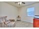 Cozy bedroom with natural light, a ceiling fan, and carpeted floor at 2493 Cherie Glen Trl, Snellville, GA 30039