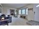 Cozy living room features a fireplace with stone surround, plush seating, and natural light at 2493 Cherie Glen Trl, Snellville, GA 30039