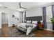 Bright primary bedroom features dark wood floors, recessed lighting and modern ceiling fan at 2020 Bixby Se St, Atlanta, GA 30317