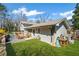 A landscaped backyard featuring lush grass, a deck and patio combination for outdoor living and enjoyment at 260 Mansell Cir, Roswell, GA 30075