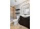 Stylish bathroom features a walk-in shower, modern vanity, and floating shelves at 260 Mansell Cir, Roswell, GA 30075
