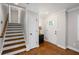 Stylish entryway features hardwood floors, white trim, and an inviting front door, creating a warm ambiance at 260 Mansell Cir, Roswell, GA 30075