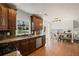 Well-equipped kitchen with granite countertops and a view to the loft-style dining area at 260 Mansell Cir, Roswell, GA 30075