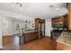 Open concept kitchen with granite countertops, stainless steel appliances, and breakfast bar at 260 Mansell Cir, Roswell, GA 30075