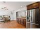 Open concept kitchen with stainless appliances and direct view to loft at 260 Mansell Cir, Roswell, GA 30075