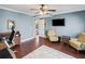 Bright office space with a ceiling fan, a TV, and two chairs at 260 Mansell Cir, Roswell, GA 30075