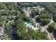 Aerial view showcasing community pool, tennis courts and nearby housing at 320 Dodd Ln, Alpharetta, GA 30005
